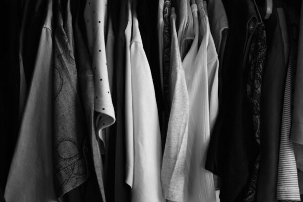 capsule wardrobe cover illustration showing a tidy closet with versatile neutral pieces